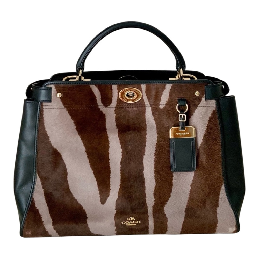 Coach,calf hair and leather top handle
Bag